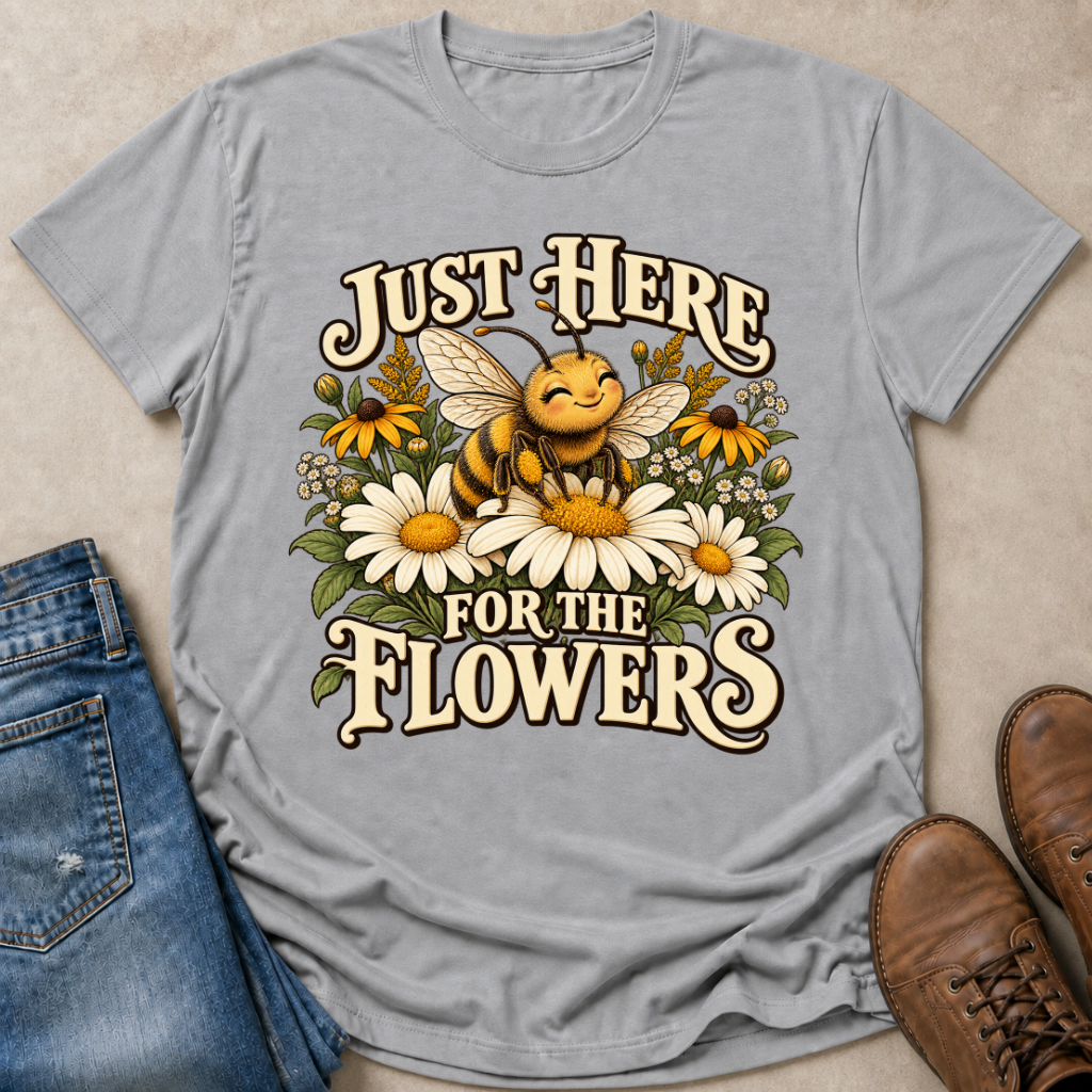 Light gray graphic T-shirt featuring a smiling bee among daisies and wildflowers with the text "Just Here for the Flowers."